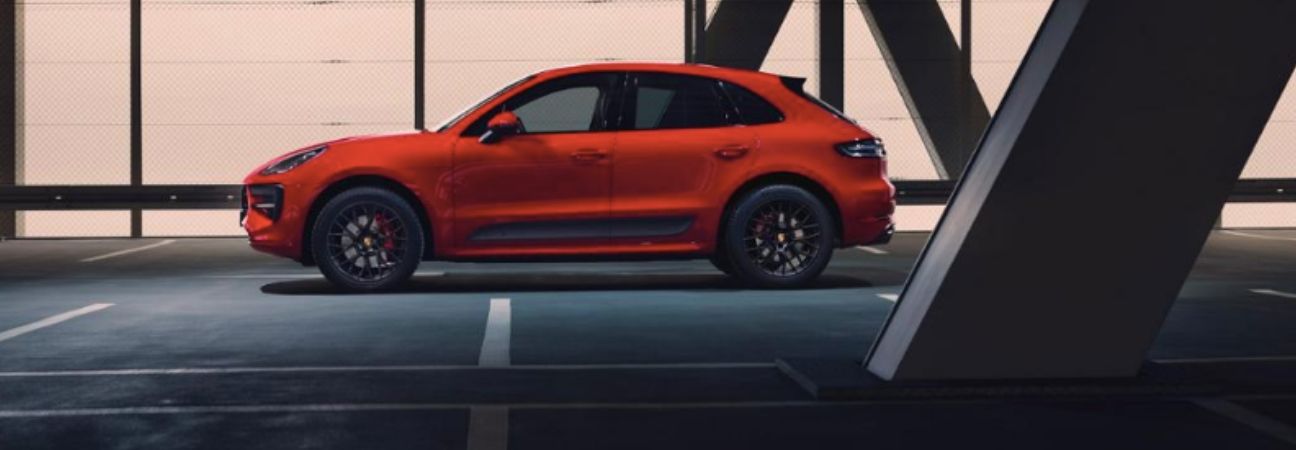 Red 2020 Porsche Macan GTS in parking garage